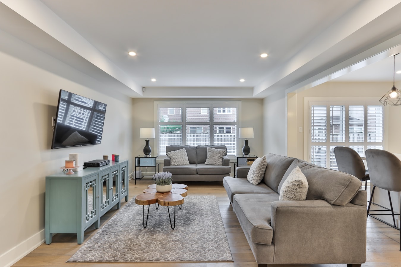 Several guests gathered in a vacation rental living room, more than expected at check-in