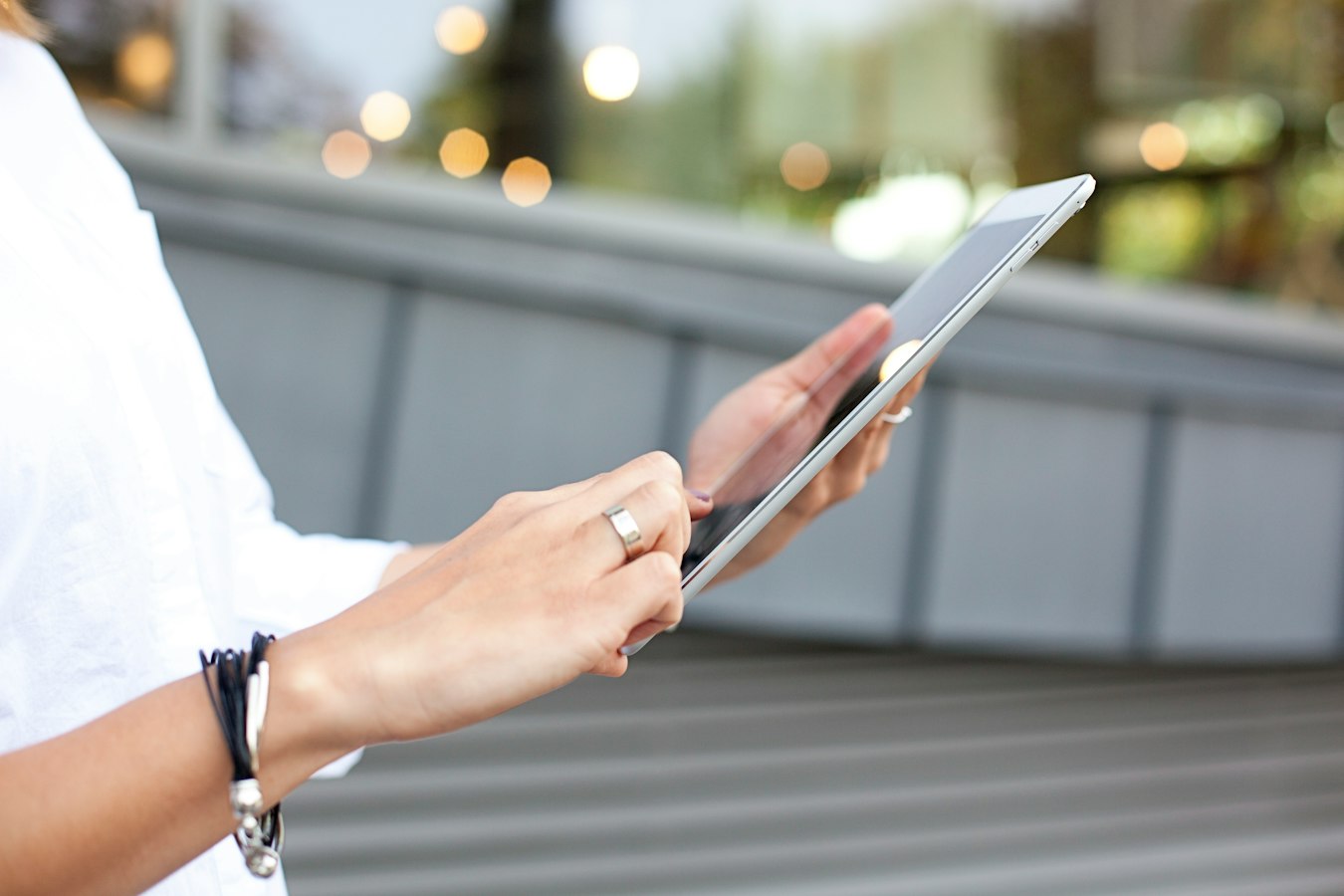 A designer reviewing their portfolio on a tablet at a clean desk