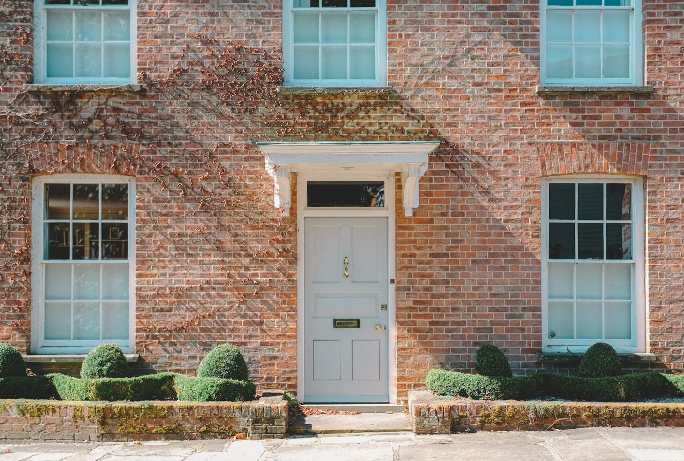 Clean short-term rental home entrance with a closed front door