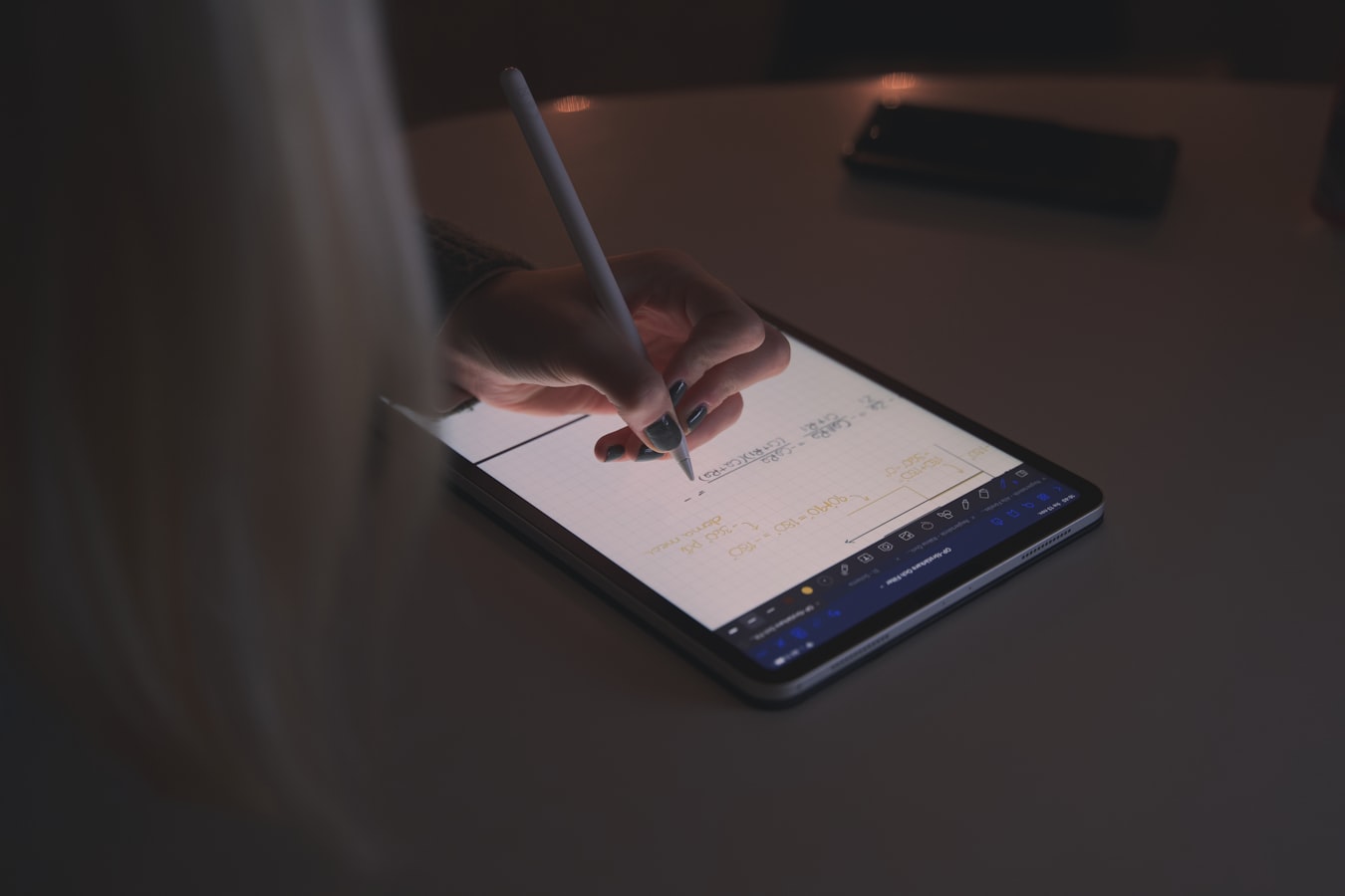 A guest reviewing and signing house rules on a tablet before a short-term rental check-in