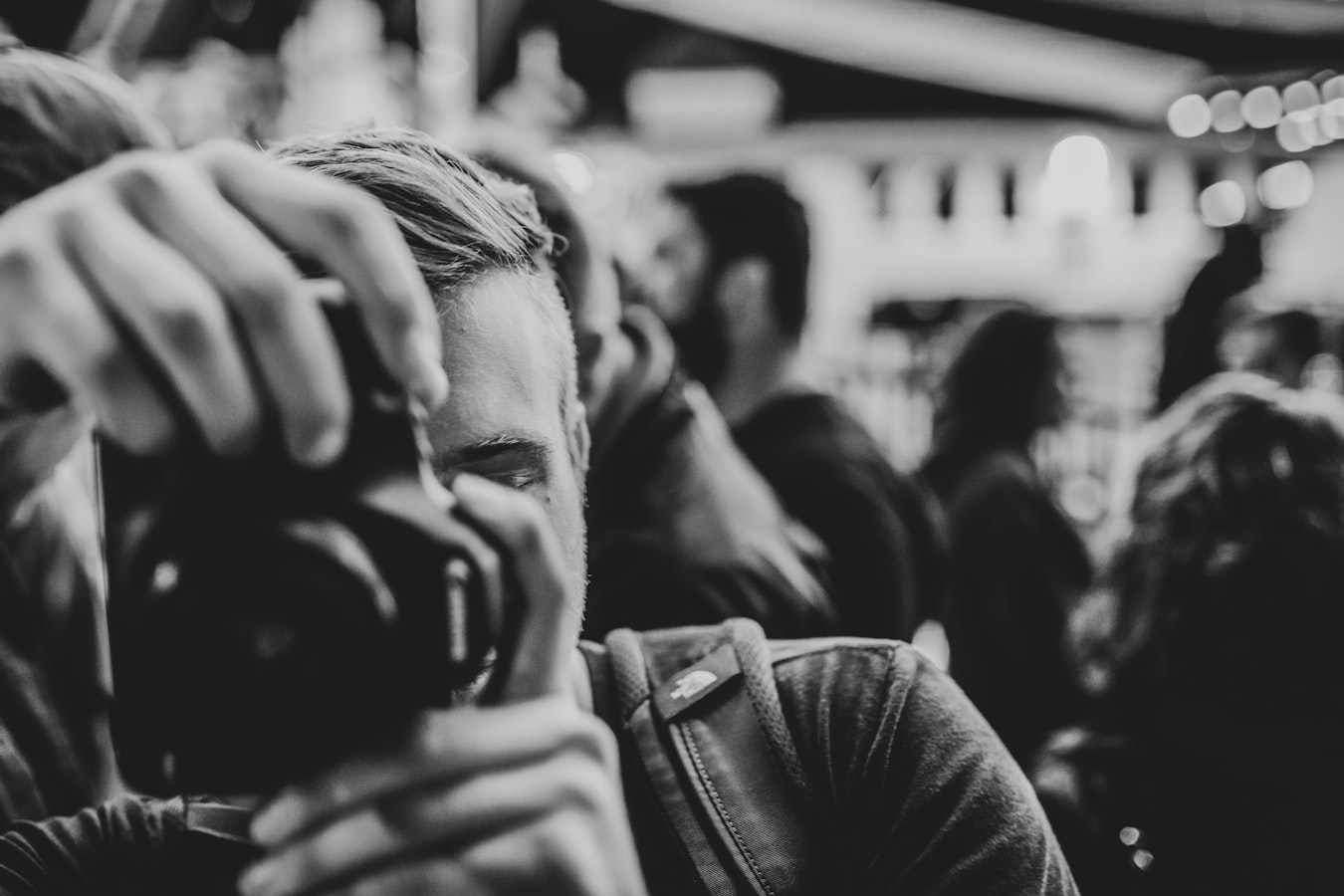 Photographer capturing guests at a live event with a professional camera