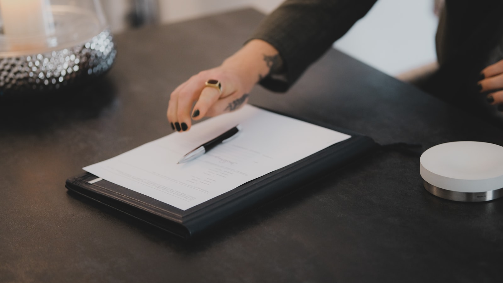 A guest reviewing and signing a check-in agreement on a tablet before entering a vacation rental