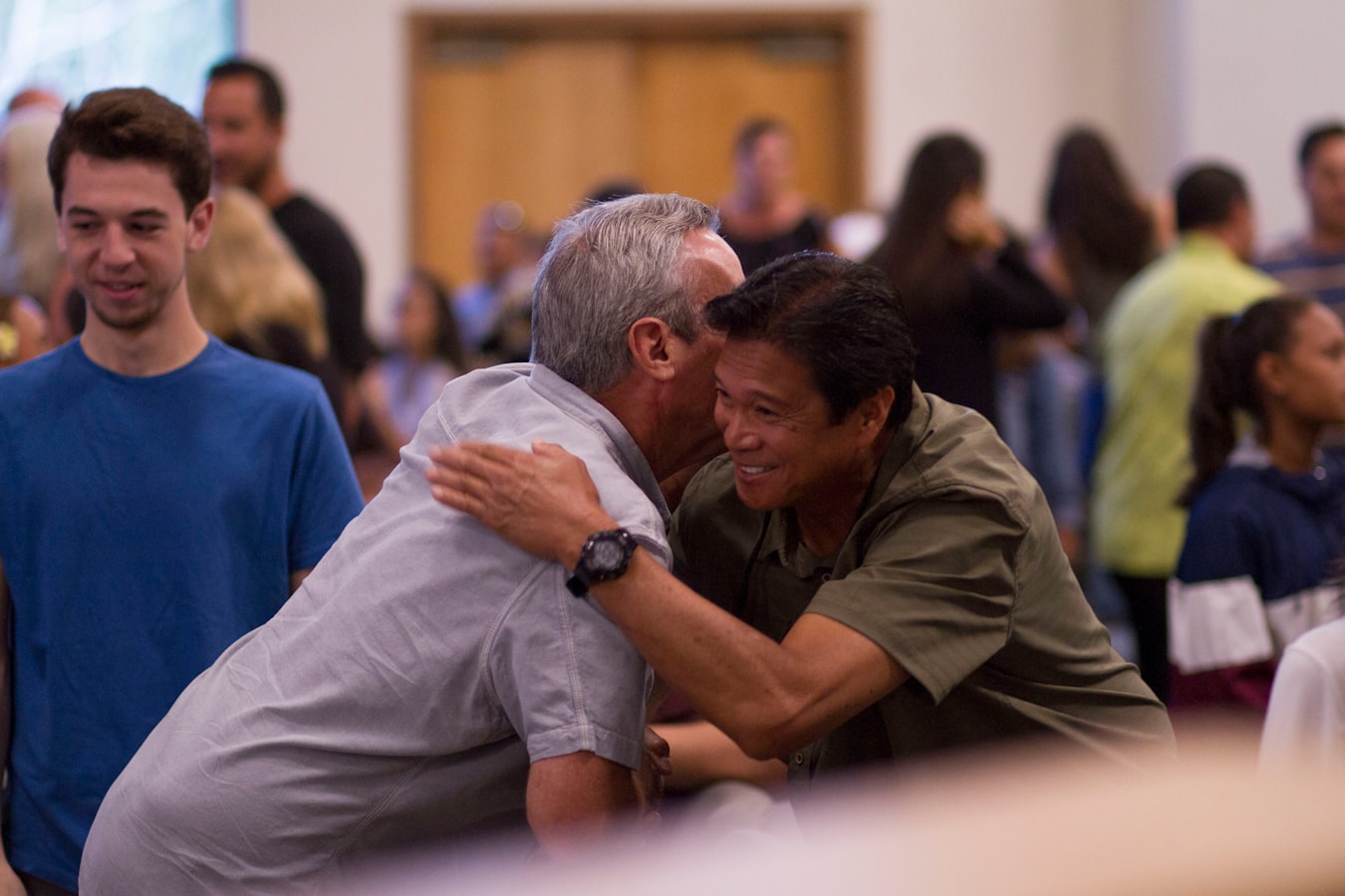 Two professionals sharing contact information after a networking event