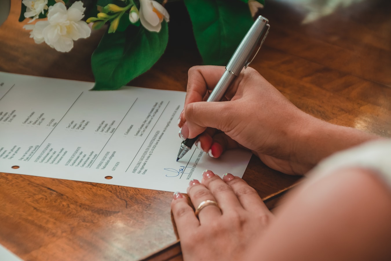 A vacation rental guest reviewing and signing an acknowledgment form on a tablet before check-in