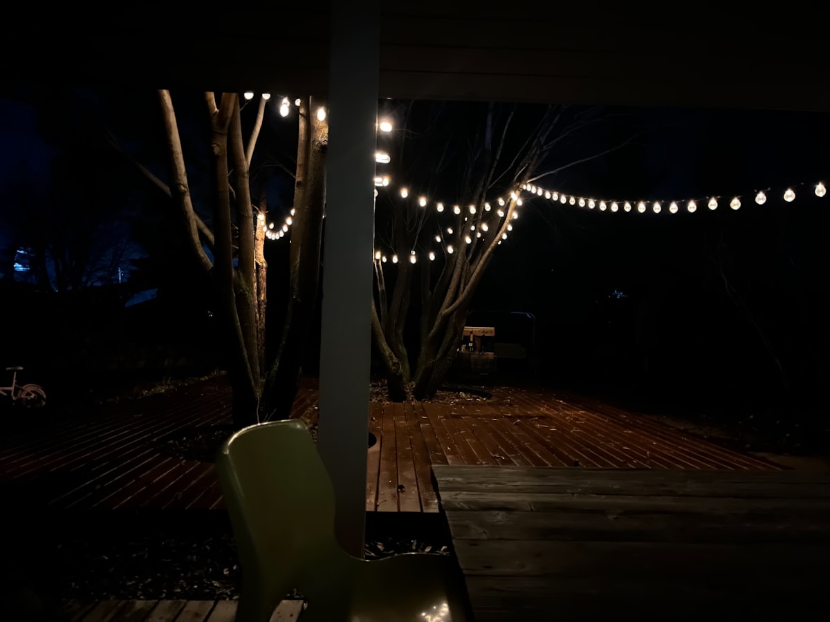 Quiet vacation rental patio at night with ambient lighting