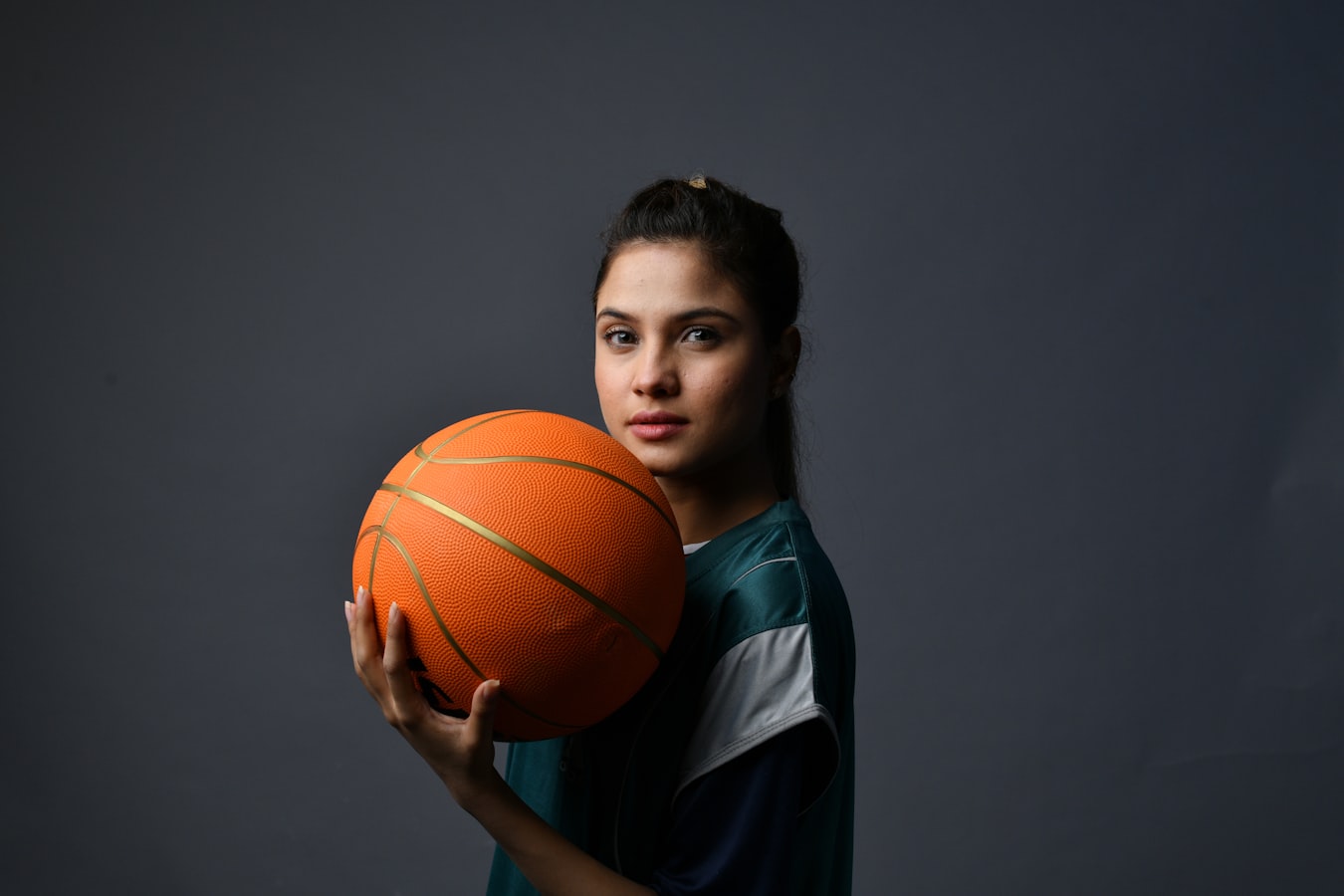 Photographer reviewing a document with an athlete on a gym shoot set