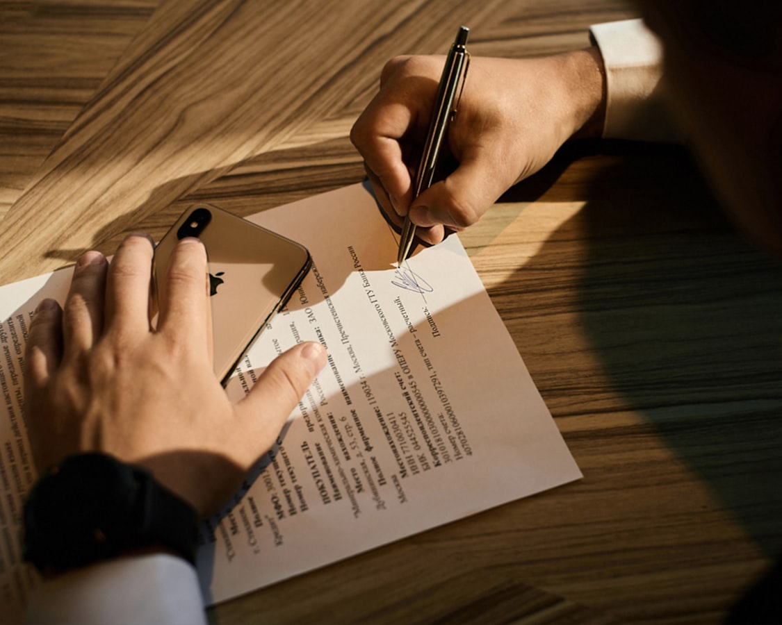 A host reviews a printed short-term rental house rules document at a desk