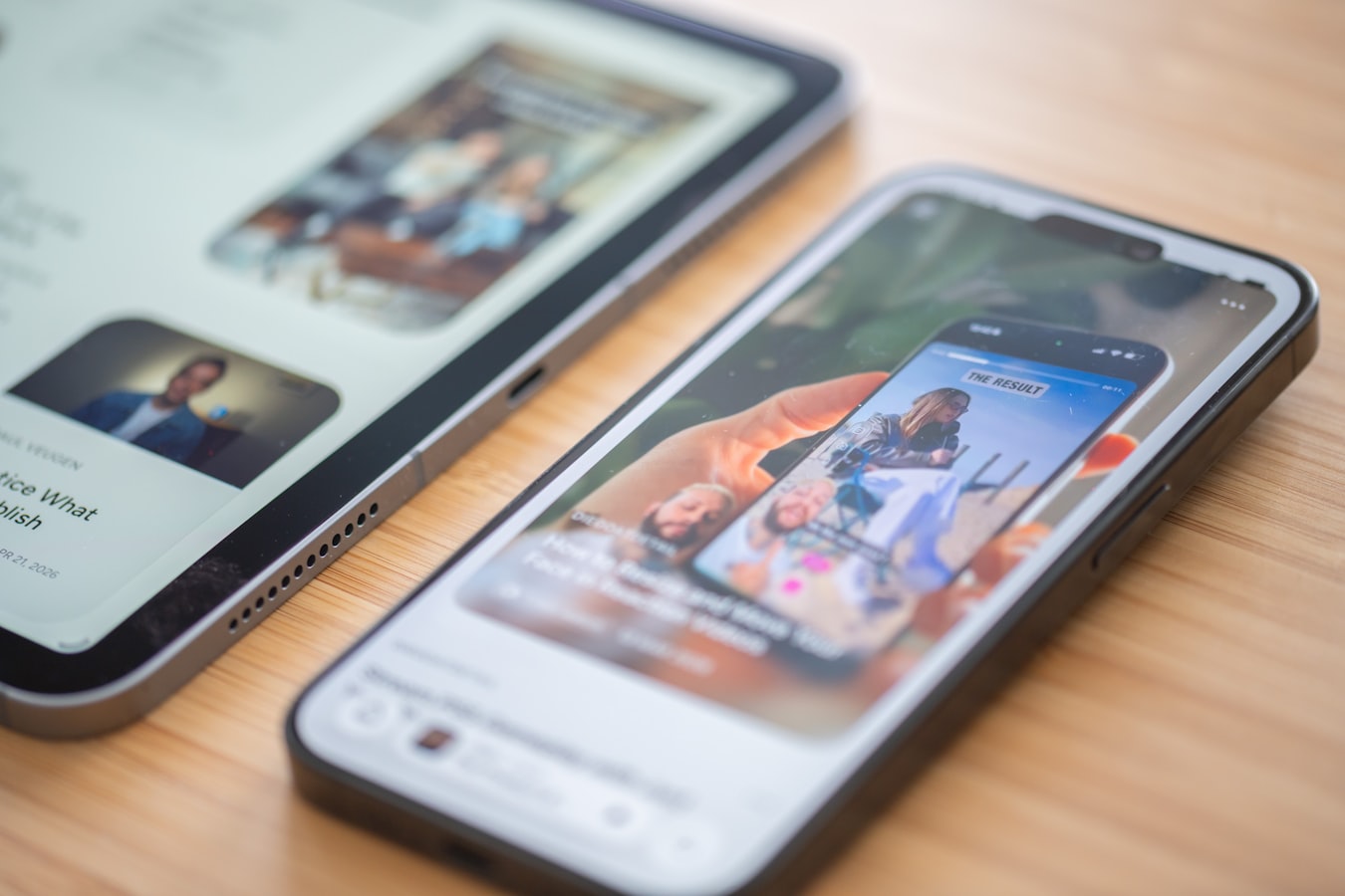 Person holding an iPhone toward another person to share contact information