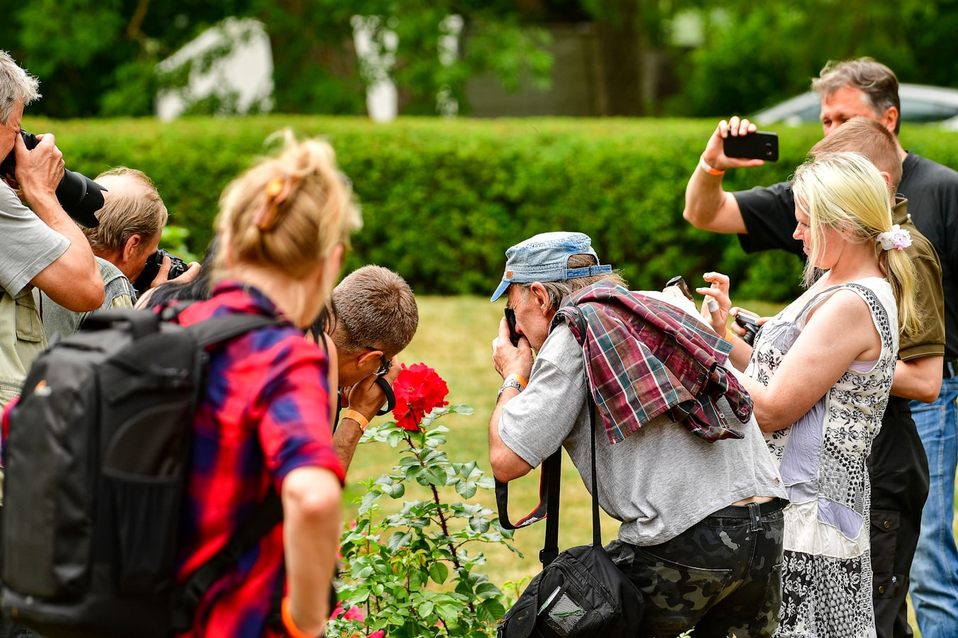 A photographer reviewing release forms with a group of subjects before a shoot
