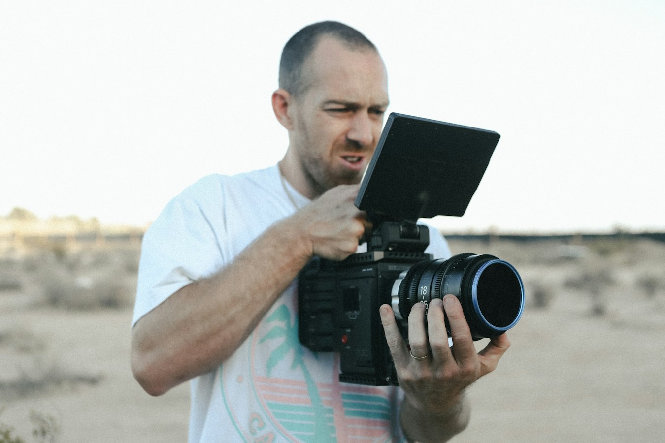 Photographer reviewing and signing a release form on set during a video shoot