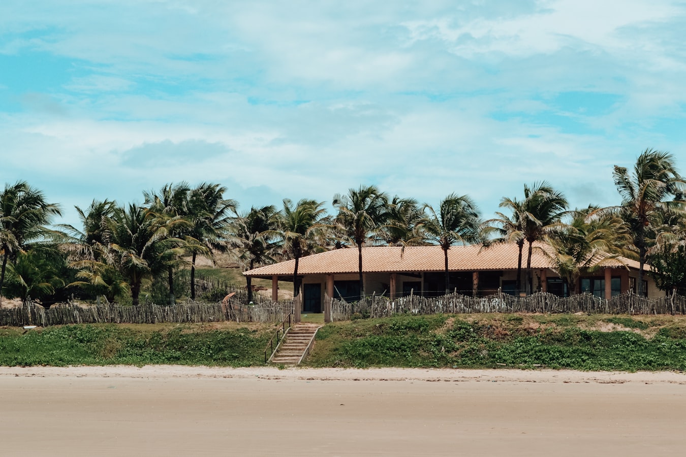 A group of guests with luggage arriving at the front door of a vacation rental home
