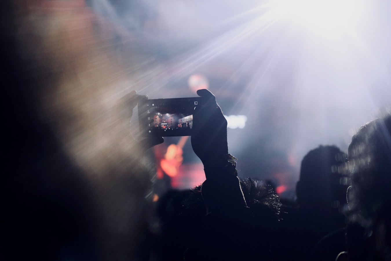 Photographer shooting a live music festival crowd from the photo pit
