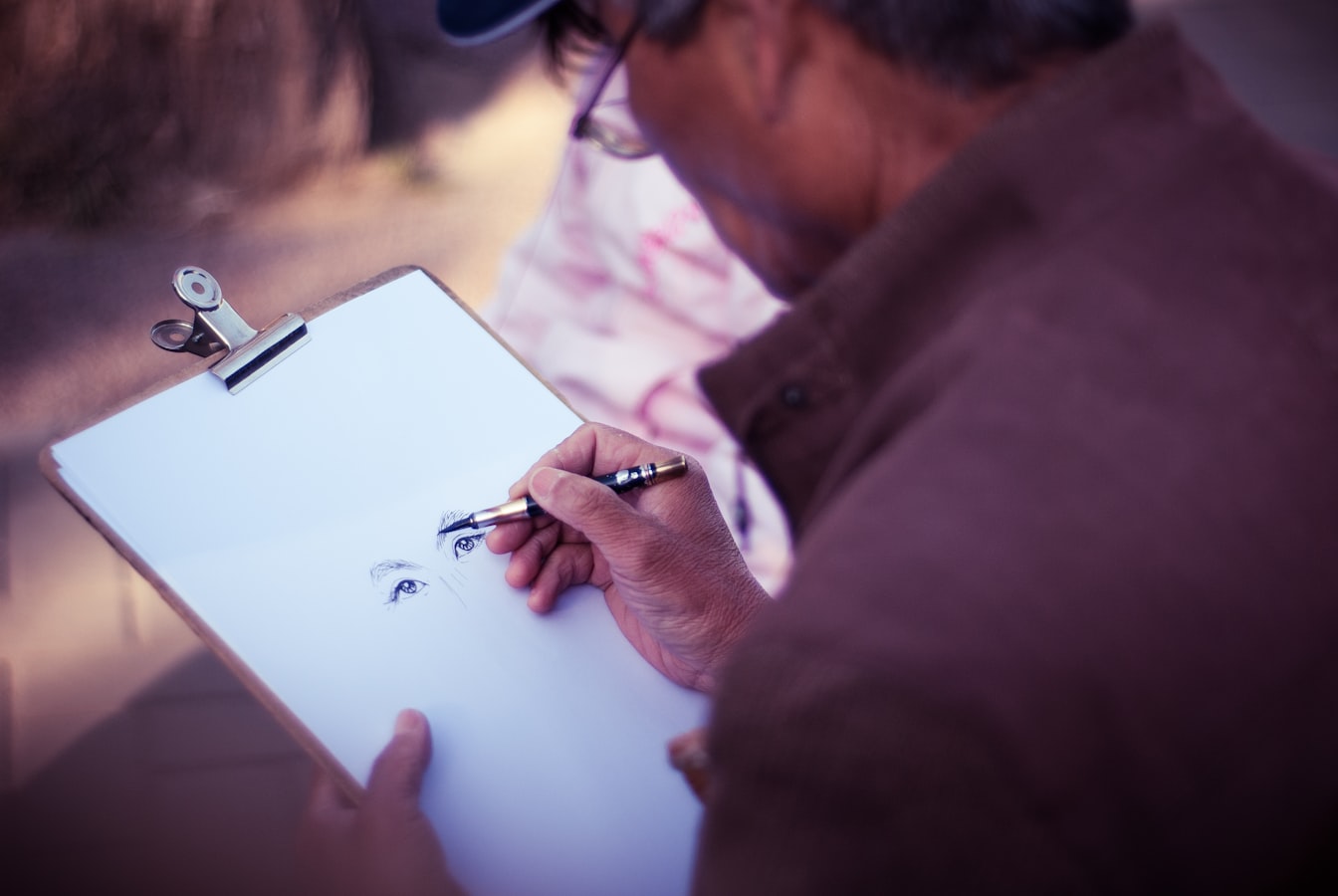 Photographer reviewing a printed model release form on a clipboard before a shoot