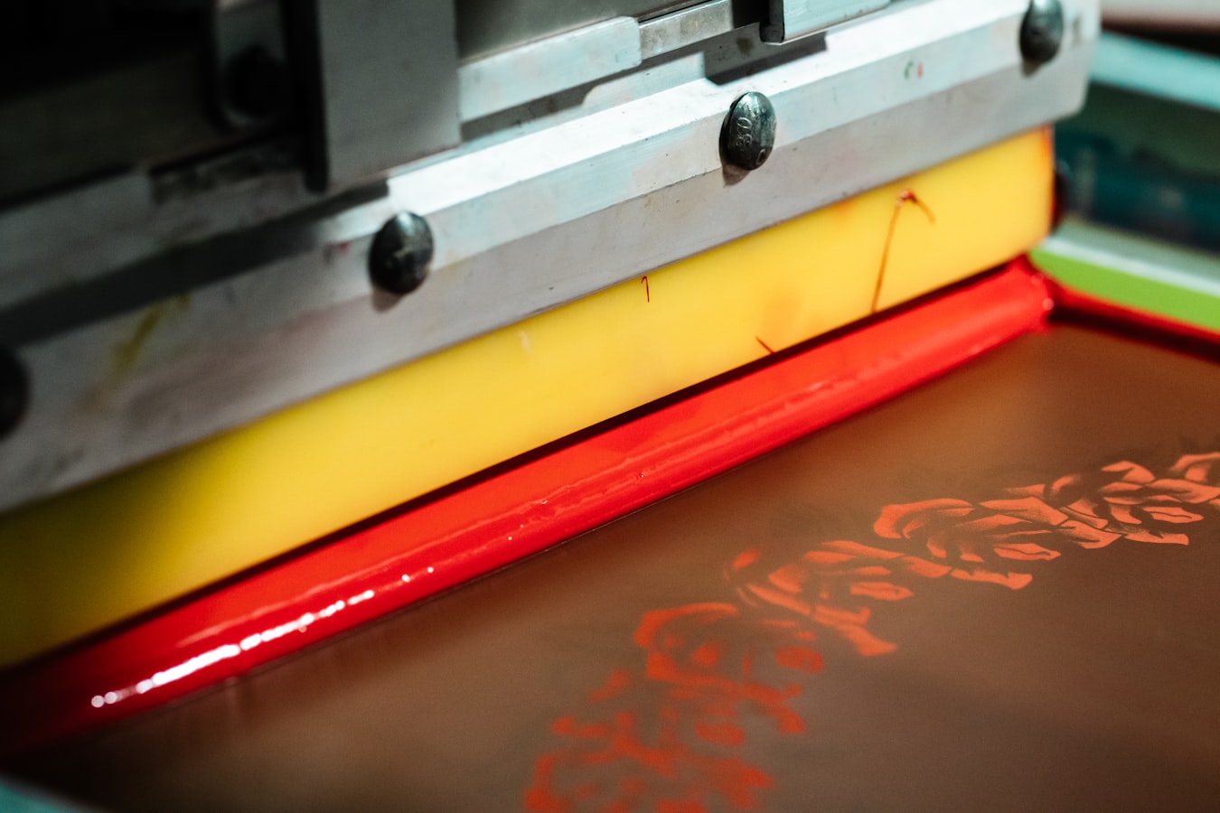A stack of freshly printed business cards fanned out on a work surface