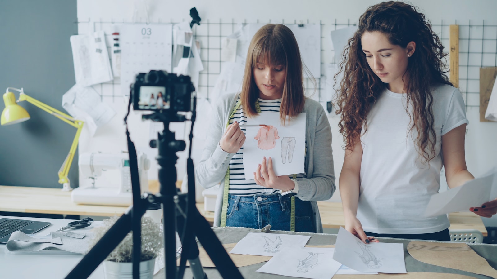 Photographer and model reviewing a printed release form on set before a commercial shoot