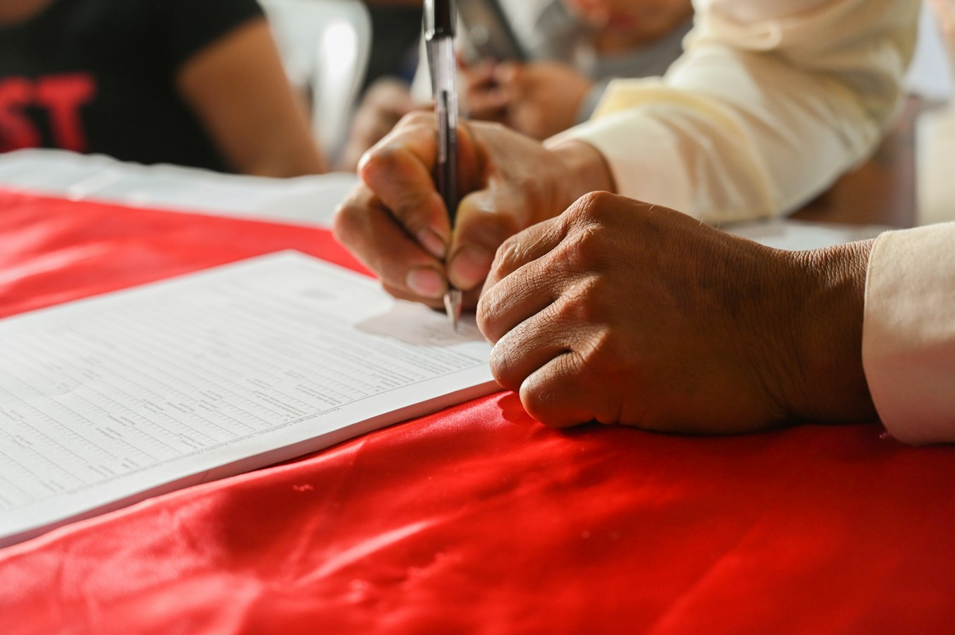 A guest reviews and signs a document at a vacation rental property