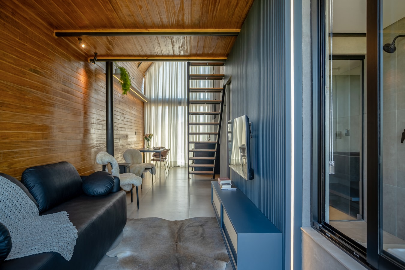 Photographer setting up a shot inside a furnished short-term rental property