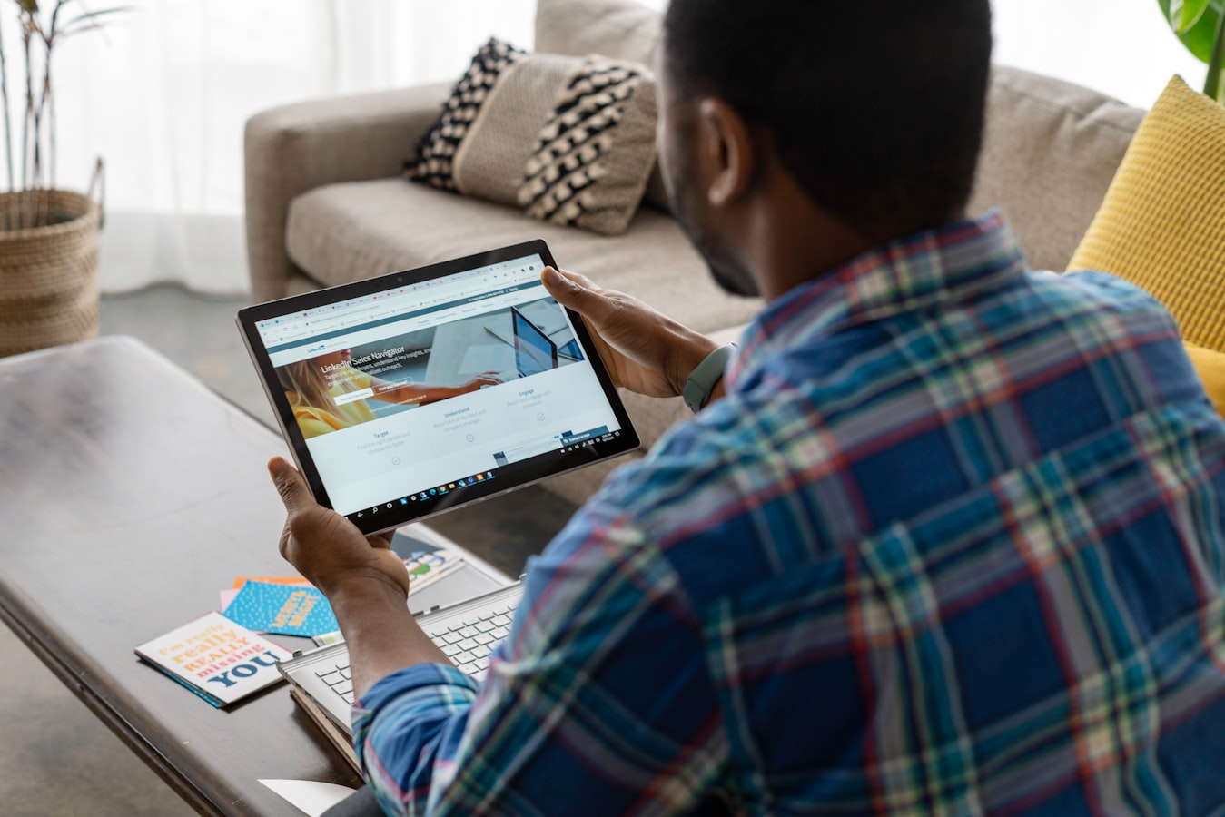 A short-term rental host reviewing guest documentation on a tablet before check-in
